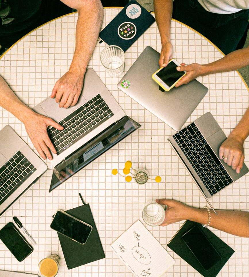 photo of people using laptop