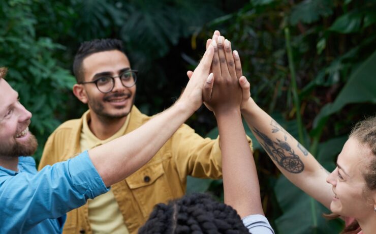 close friends high fiving each other