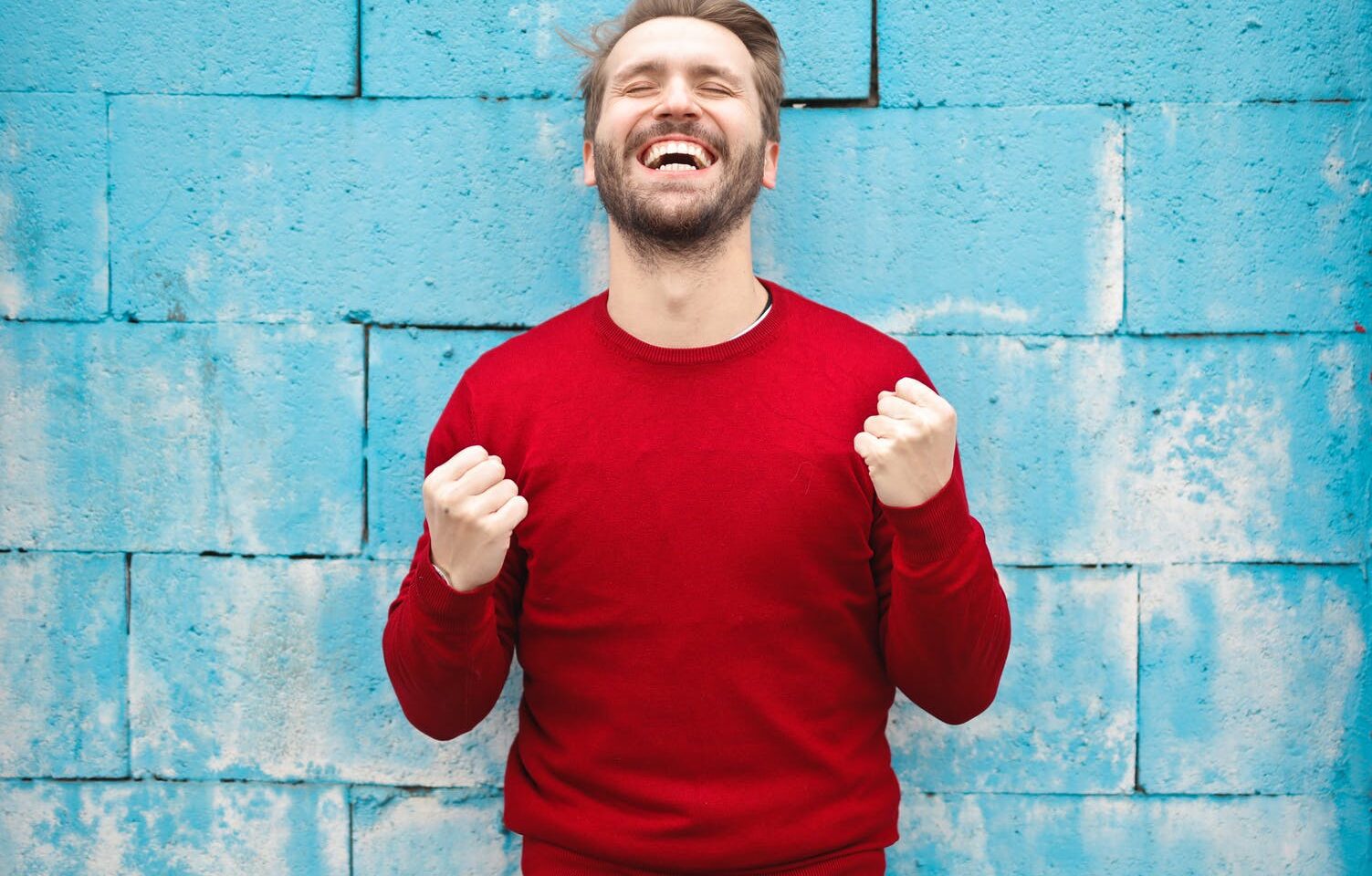 man in red crew neck sweatshirt photography